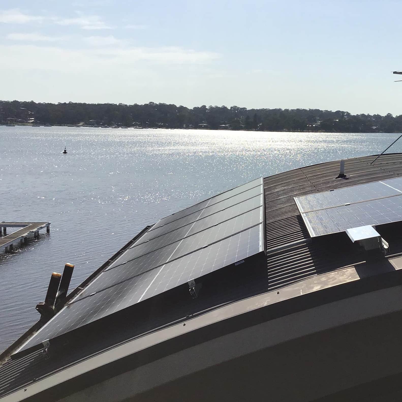 dad with little girl looking at home with solar