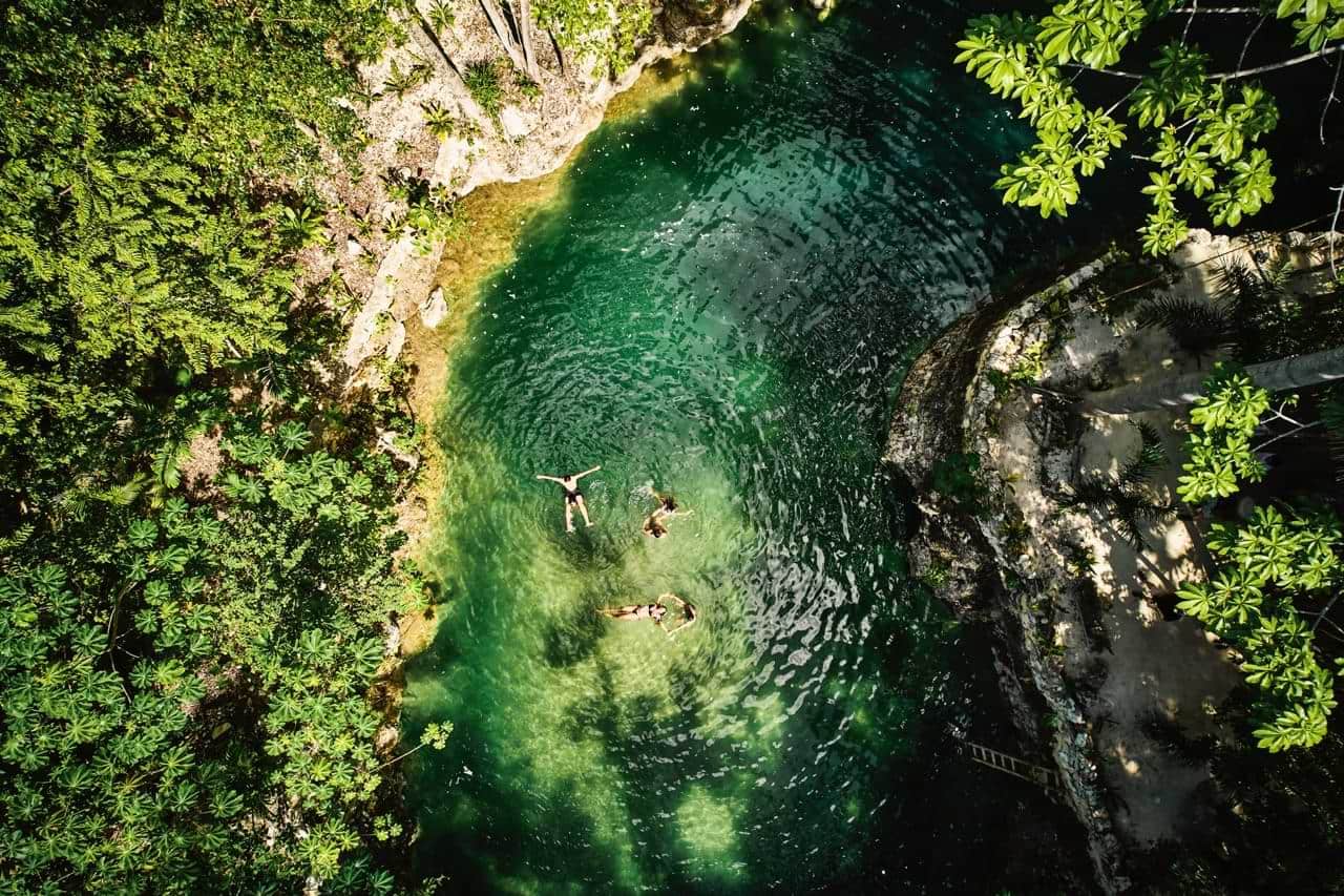 people bathing in the river