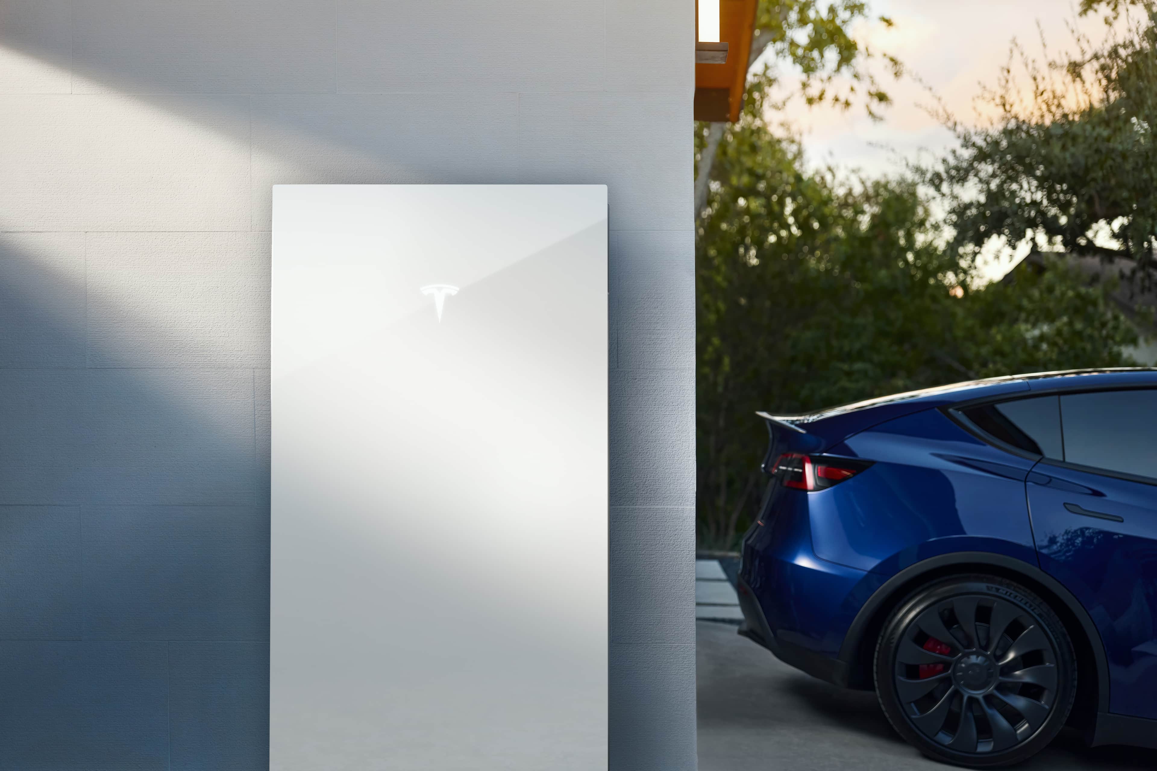 Tesla Powerwall 3 mounted on a concrete wall