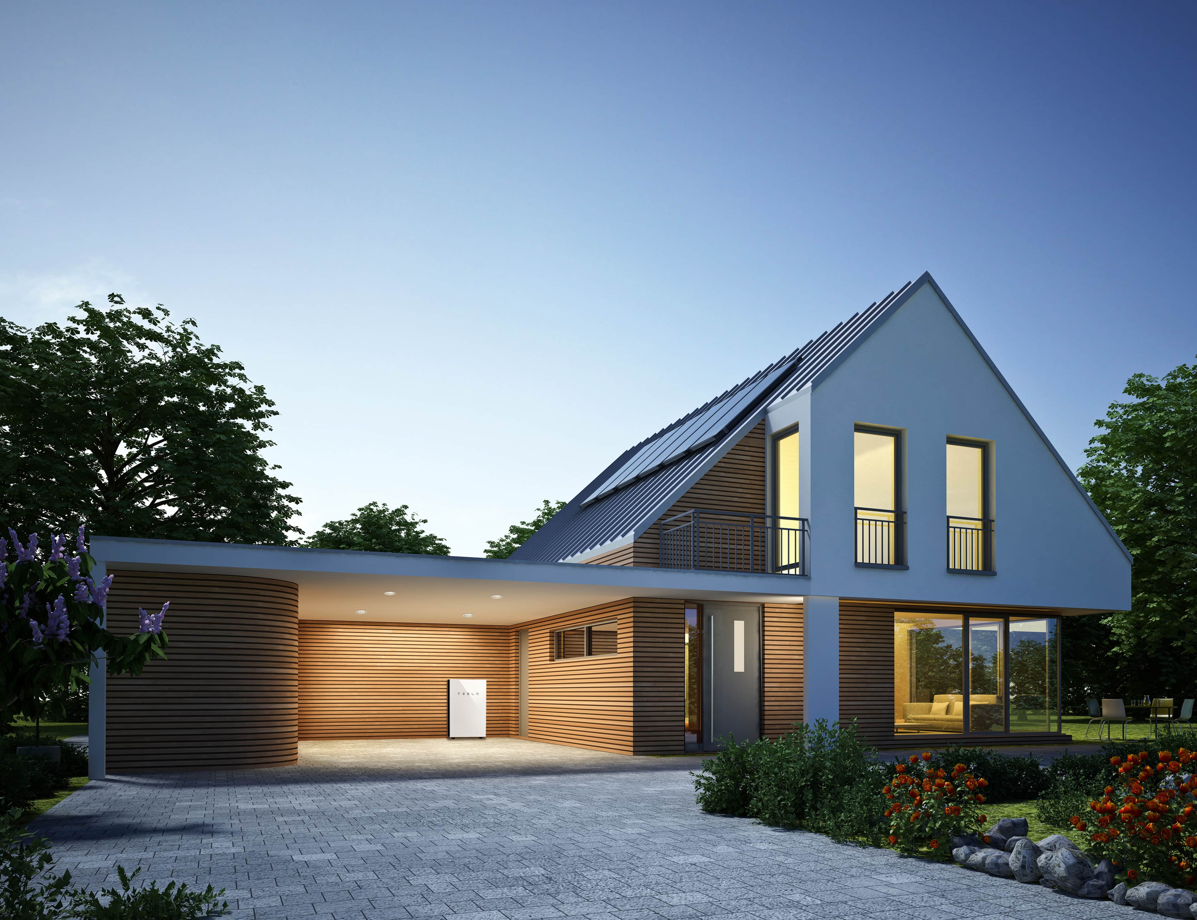 Tesla Powerwall Mounted on the Wall outside of a modern house