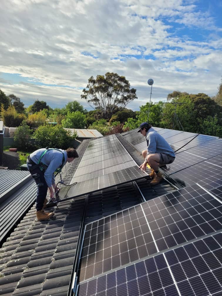 dad with little girl looking at home with solar