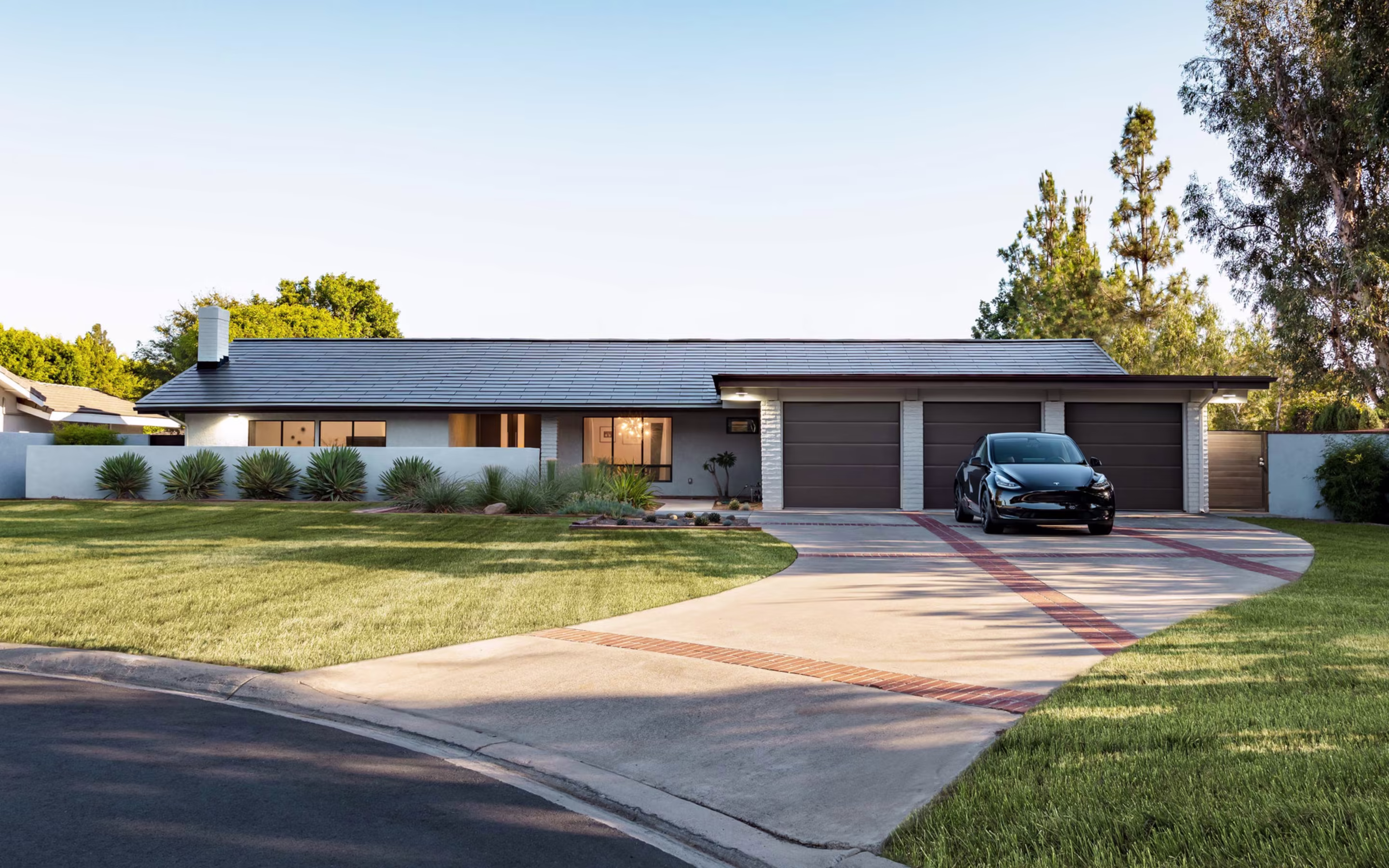 a modern house with Tesla solar roof tiles