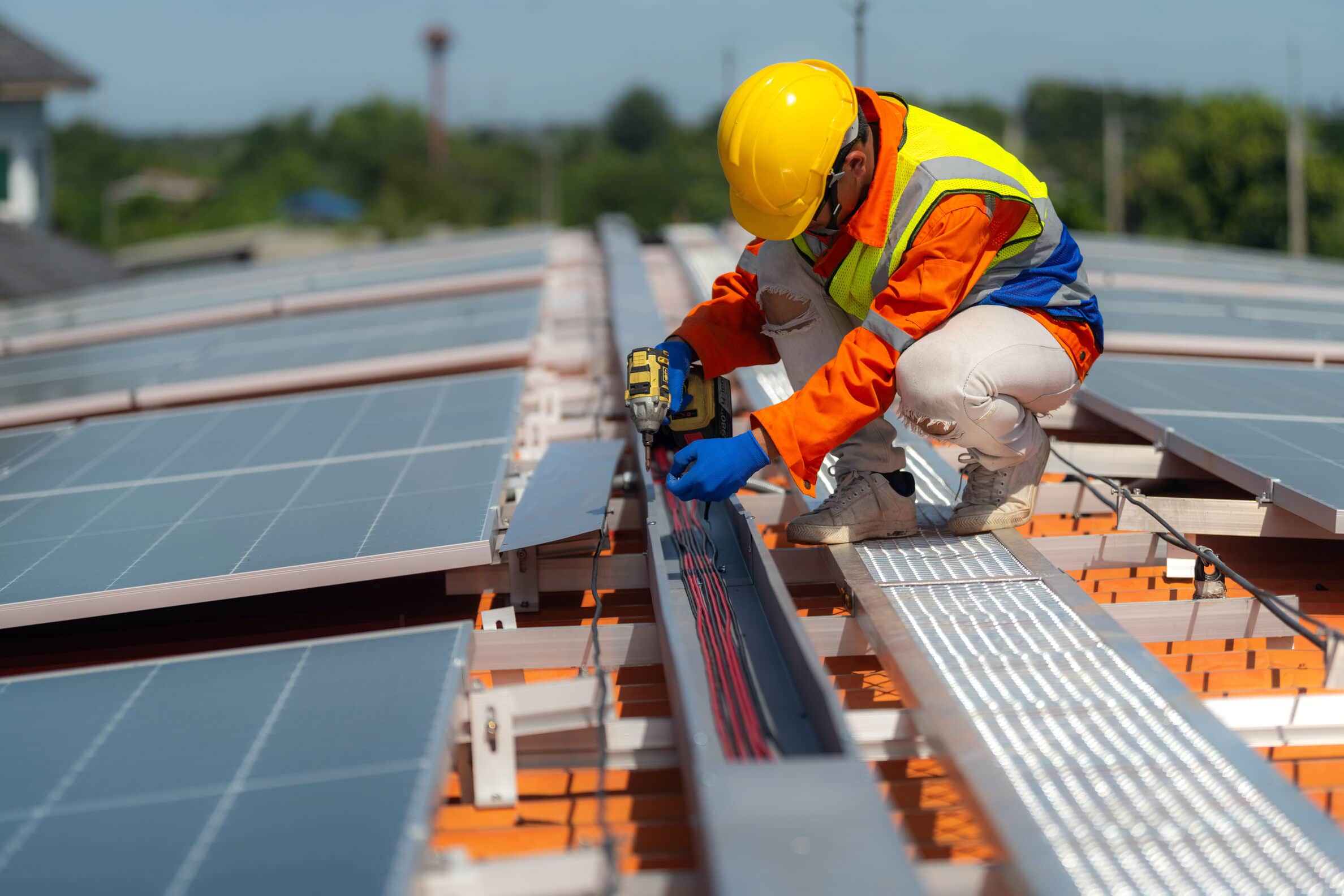 two engineers fixing solar panels