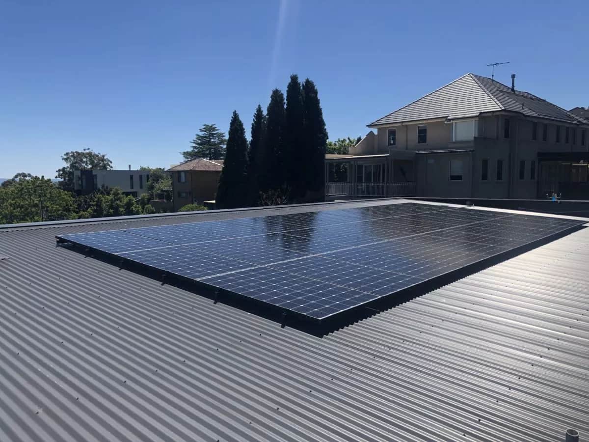 5kW solar panel system installed on a flat tin roof
