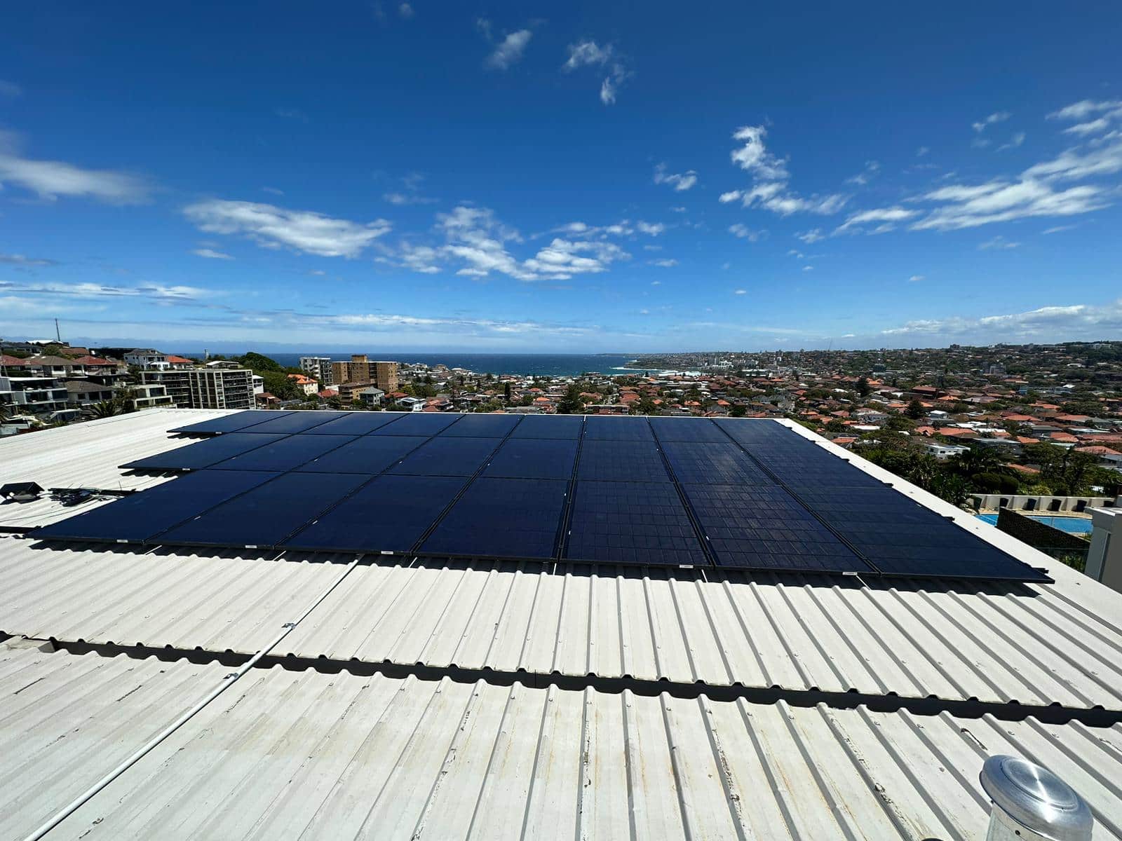 solar panel arrays install on a tin roof