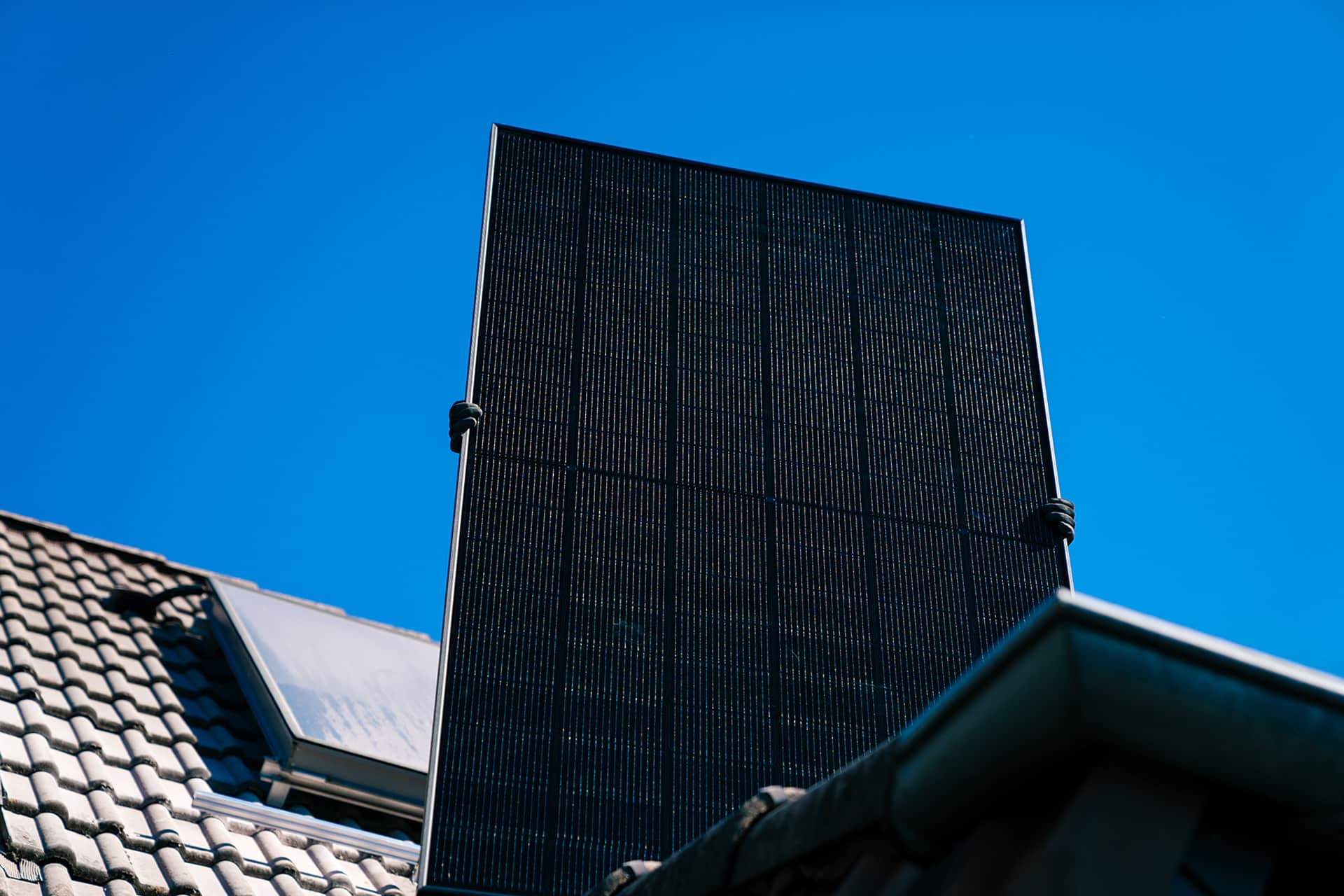 technicians carrying photovoltaic solar module