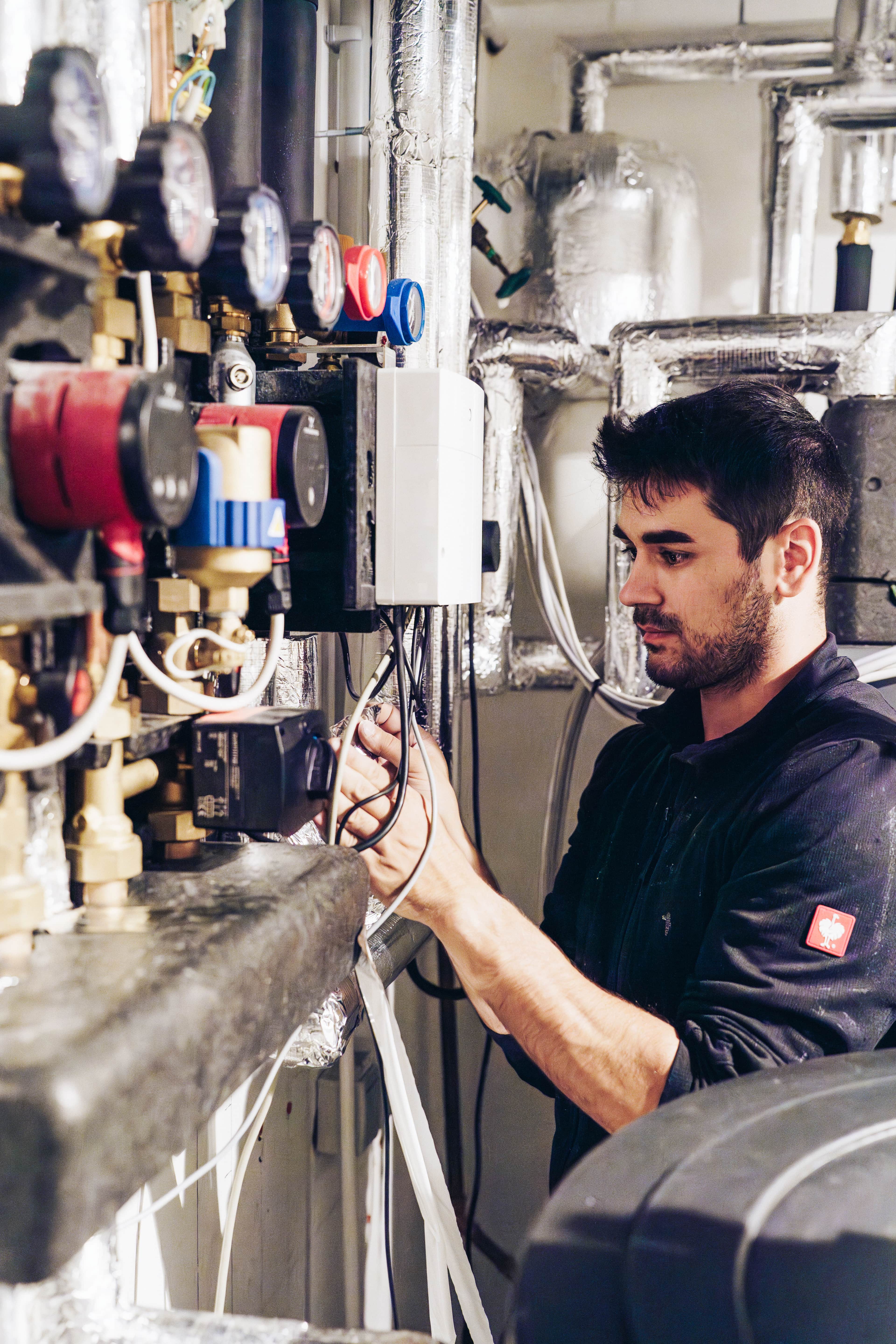 a technician connecting wires and checking components