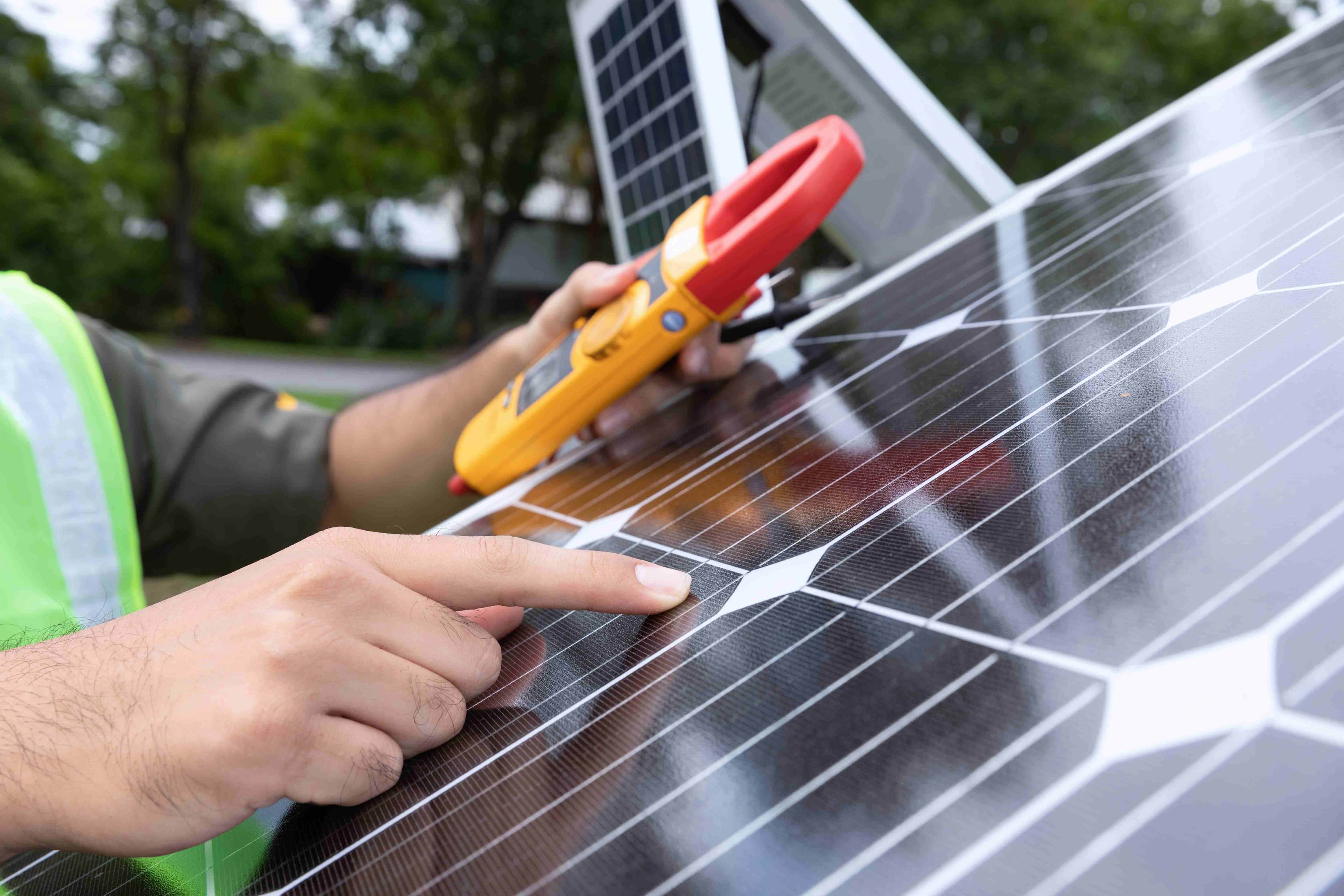 engineer with energy measurement tool